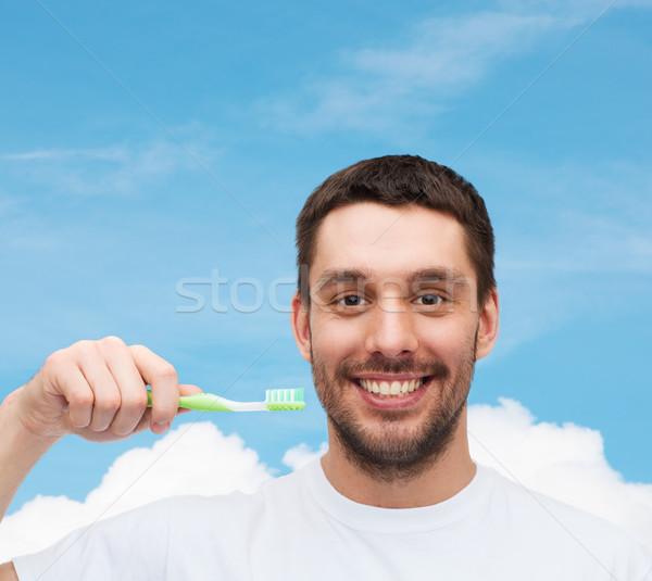 Sonriendo joven cepillo de dientes salud belleza cielo Foto stock © dolgachov