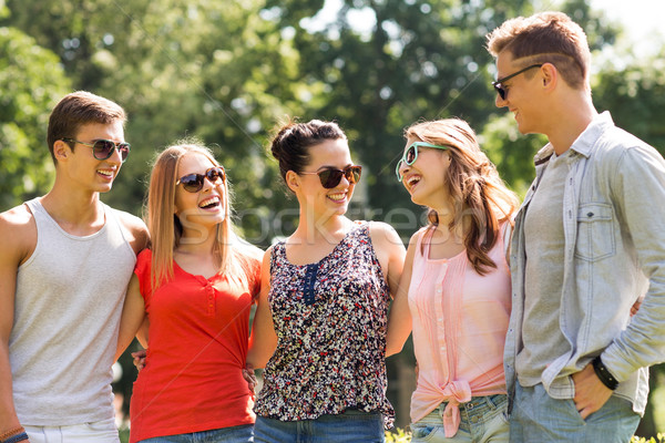 group of smiling friends outdoors Stock photo © dolgachov