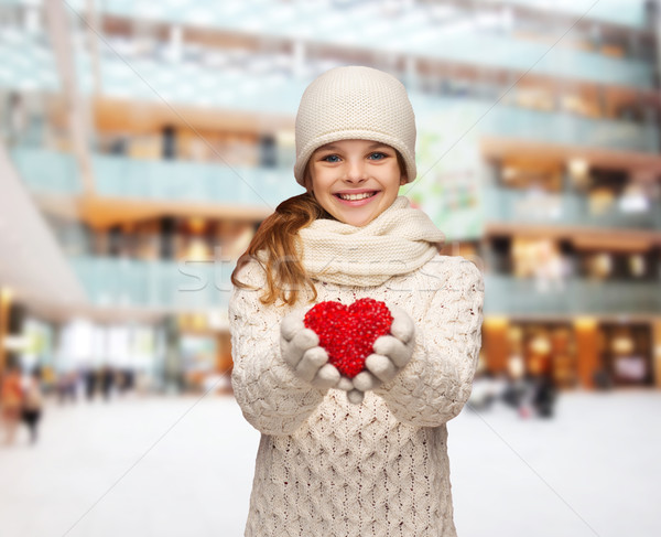 dreaming girl in winter clothes with red heart Stock photo © dolgachov