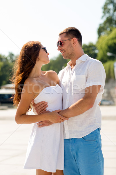 smiling couple in city Stock photo © dolgachov