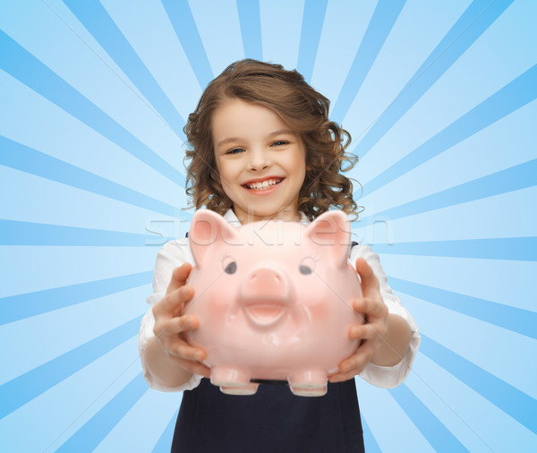 happy girl holding piggy bank  Stock photo © dolgachov