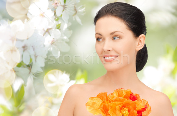 beautiful young woman with flowers Stock photo © dolgachov