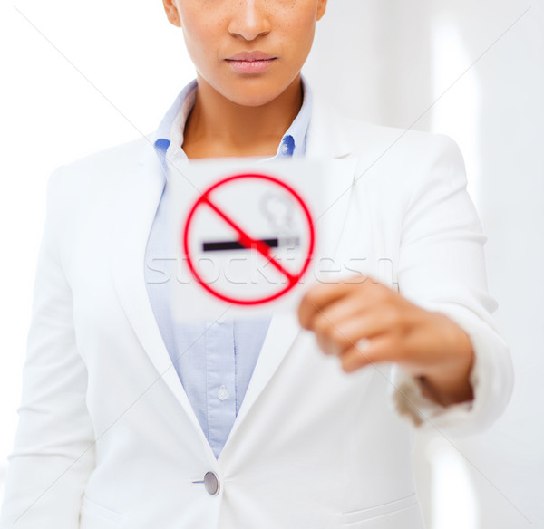 african woman with restriction no smoking sign Stock photo © dolgachov