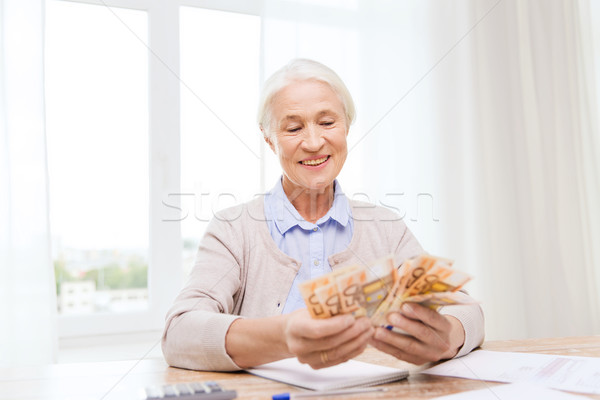 Stockfoto: Senior · vrouw · geld · papieren · home · business
