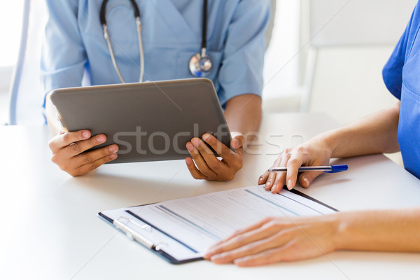 close up of doctors with tablet pc at hospital Stock photo © dolgachov