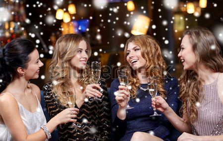 happy young women with sparklers over night city Stock photo © dolgachov