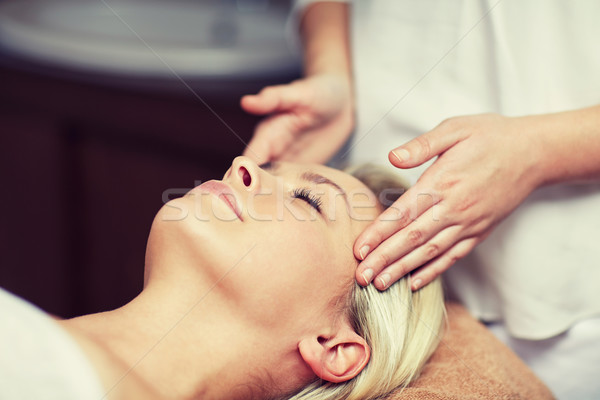 close up of woman having face massage in spa Stock photo © dolgachov