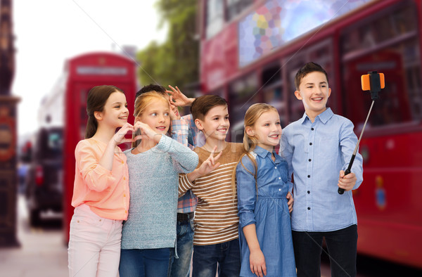 kids taking selfie by smartphone over london city Stock photo © dolgachov