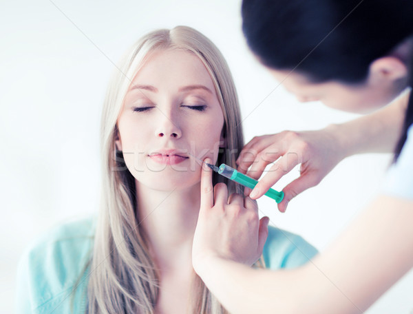 beautician with patient doing injection Stock photo © dolgachov