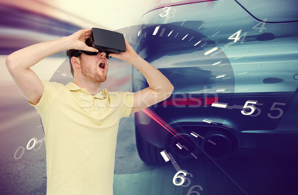 man in virtual reality headset and car racing game Stock photo © dolgachov