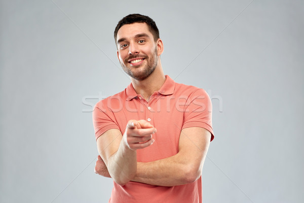 man pointing finger to you over gray background Stock photo © dolgachov