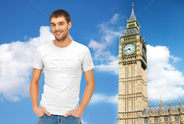 happy man in blank white t-shirt over big ben Stock photo © dolgachov