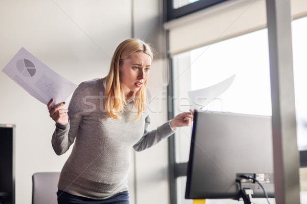 pregnant businesswoman stressing at office work Stock photo © dolgachov