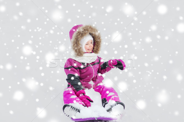 happy little kid on sled outdoors in winter Stock photo © dolgachov
