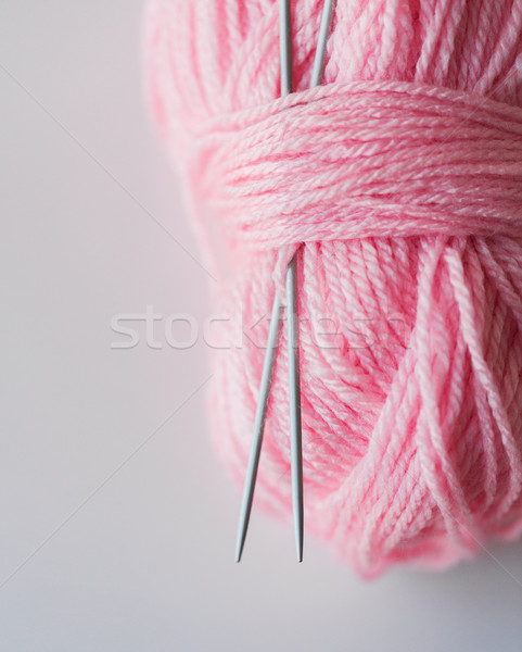 close up of knitting needles and pink yarn ball  Stock photo © dolgachov