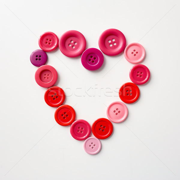 heart shape of sewing buttons Stock photo © dolgachov
