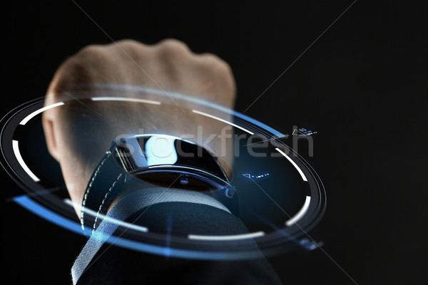 close up of businessman hand with smartwatch Stock photo © dolgachov