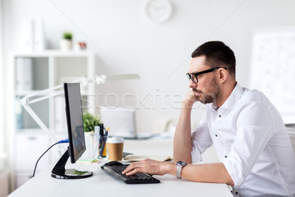 businessman typing on computer keyboard at office Stock photo © dolgachov
