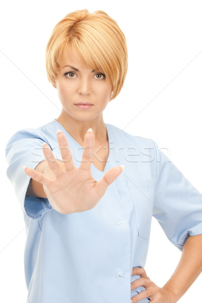 Stock photo: attractive female doctor showing stop gesture