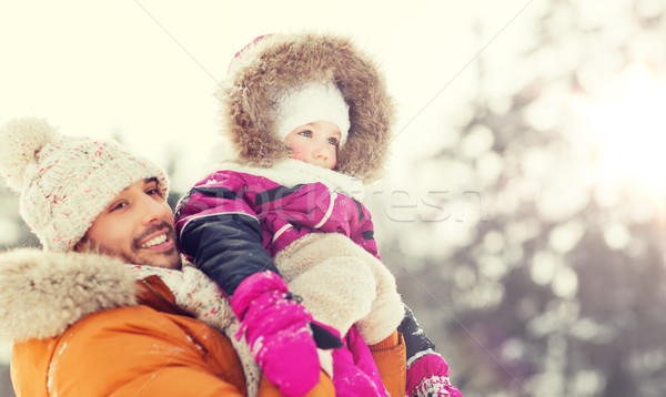 happy family in winter clothes outdoors Stock photo © dolgachov