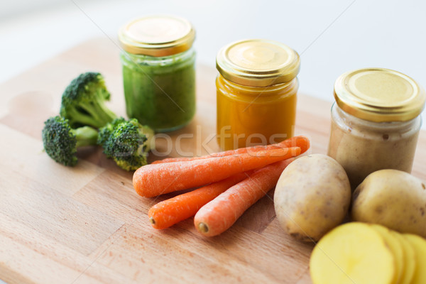 vegetable puree or baby food in glass jars Stock photo © dolgachov