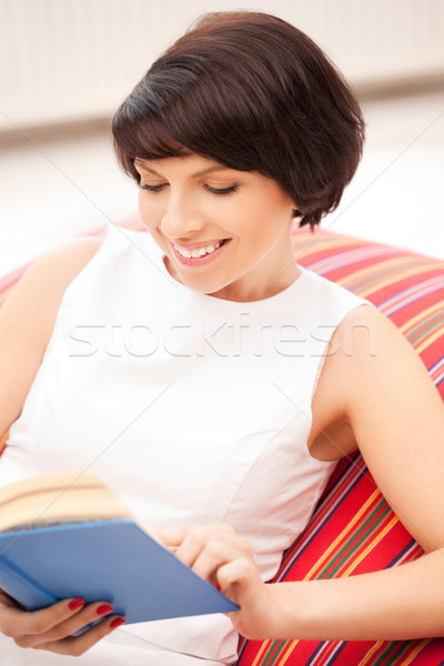 happy and smiling woman with book Stock photo © dolgachov