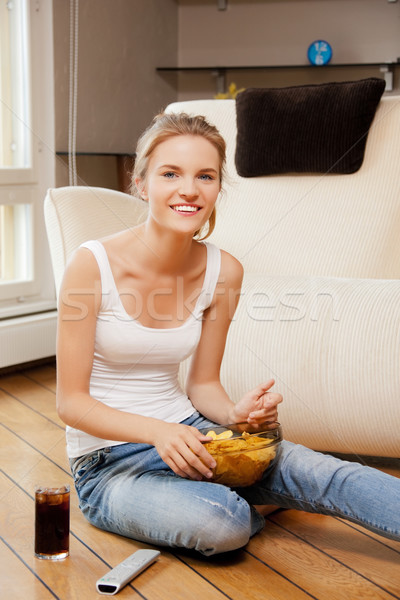 smiling teenage girl with remote control Stock photo © dolgachov