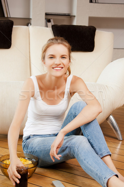 smiling teenage girl with remote control Stock photo © dolgachov