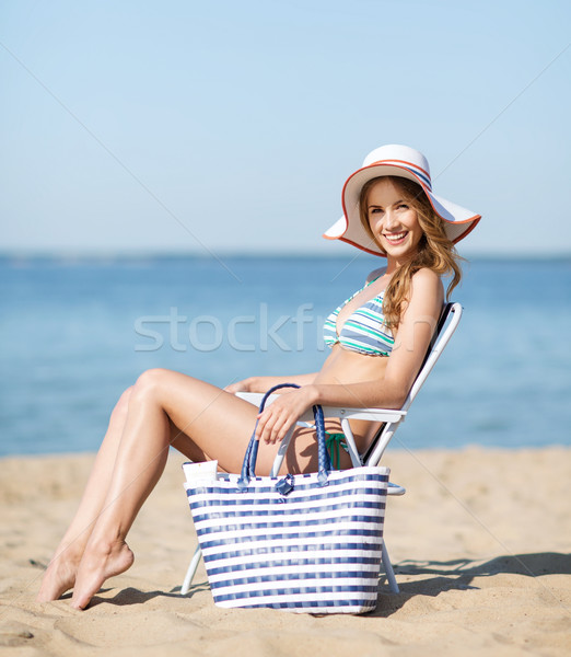 girl sunbathing on the beach chair Stock photo © dolgachov