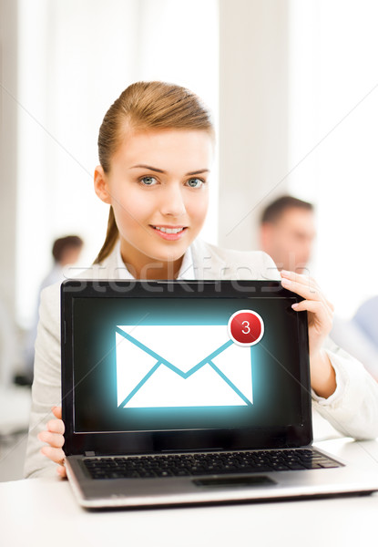 businesswoman holding laptop with email sign Stock photo © dolgachov