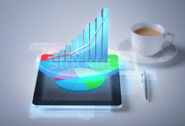 tablet pc with virtual graph or chart Stock photo © dolgachov
