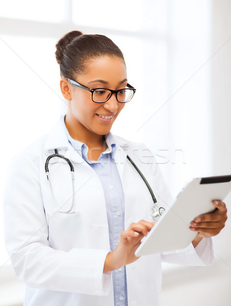 african doctor with tablet pc Stock photo © dolgachov