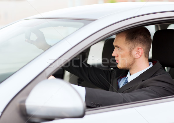 businessman driving a car Stock photo © dolgachov
