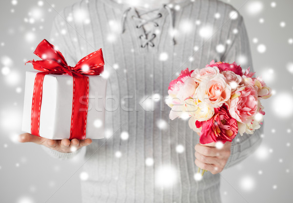 Stock photo: man holding bouquet of flowers and gift box