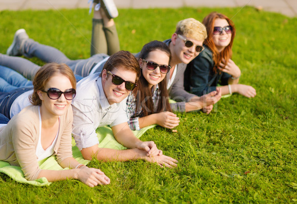 Stock photo: group of students or teenagers hanging out