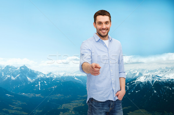 smiling man pointing finger at you Stock photo © dolgachov