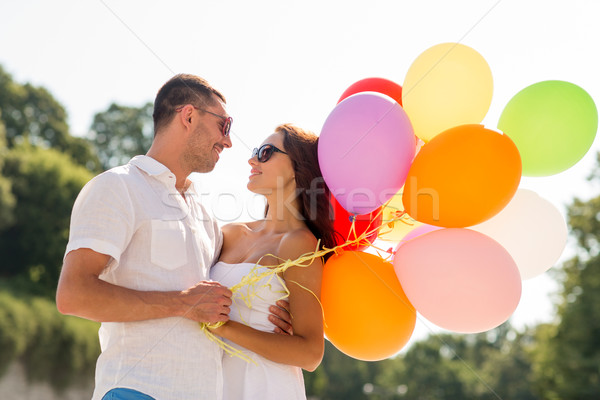 smiling couple in city Stock photo © dolgachov