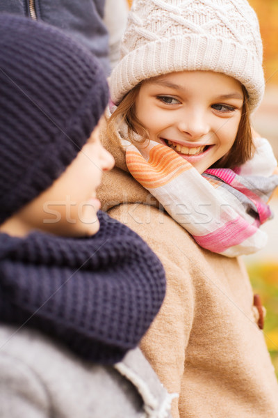 close up of smiling children in autumn park Stock photo © dolgachov