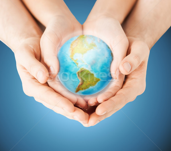close up of woman and man hands with earth globe Stock photo © dolgachov