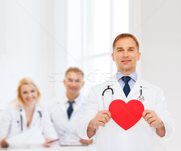 Stock fotó: Mosolyog · férfi · orvos · piros · szív · sztetoszkóp · gyógyszer