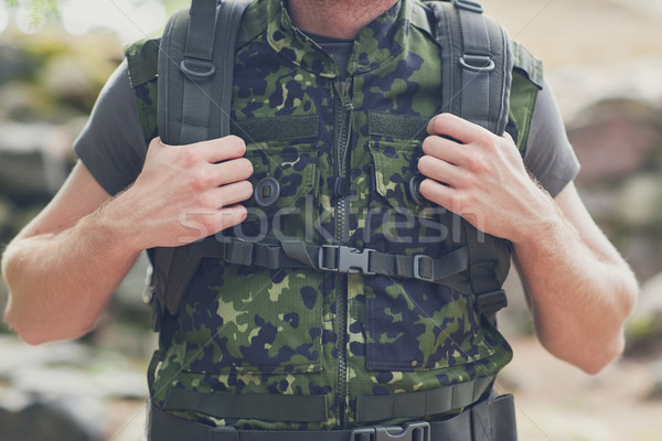 close up of young soldier with backpack in forest Stock photo © dolgachov