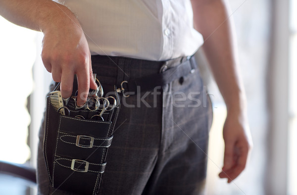 close up of male stylist with tool case at salon Stock photo © dolgachov