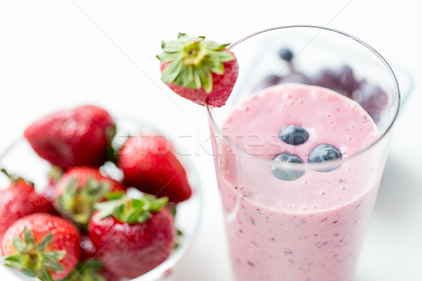 close up of milkshake decorated with strawberry Stock photo © dolgachov