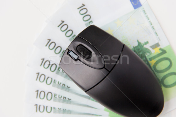 close up of computer mouse and euro money Stock photo © dolgachov