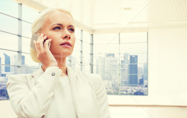 businesswoman calling on smartphone Stock photo © dolgachov