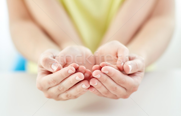 close up of woman and girl with cupped hands Stock photo © dolgachov