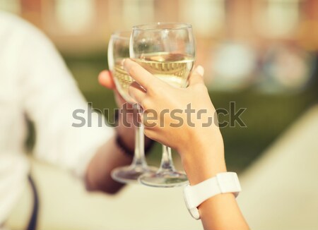 Stock photo: close up of lesbian couple with champagne glasses