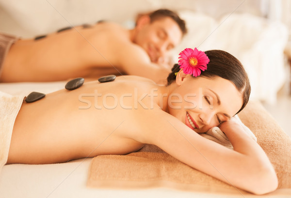 couple in spa with hot stones Stock photo © dolgachov