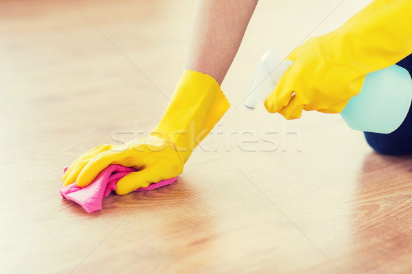 close up of woman with rag cleaning floor at home Stock photo © dolgachov