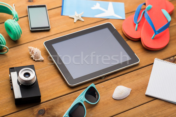 close up of tablet pc and travel stuff Stock photo © dolgachov